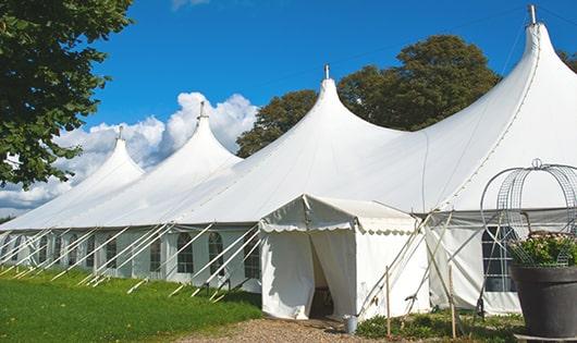 a group of luxury portable restrooms with individual stalls and running water in Londonderry